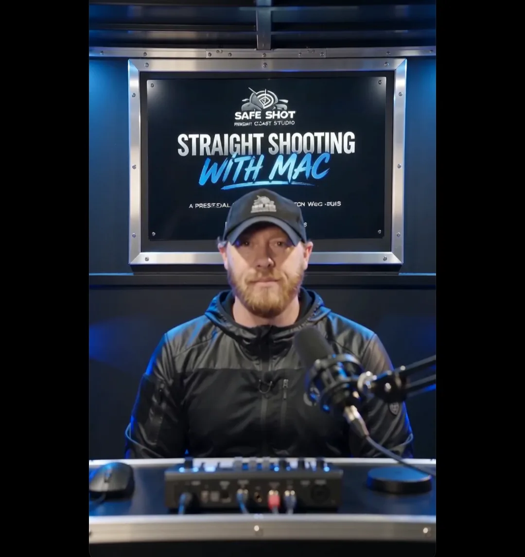 Garrett seated behind a microphone in the Safe Shot podcast studio